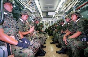 GSDF troops ride subway to Tokyo disaster-relief drills